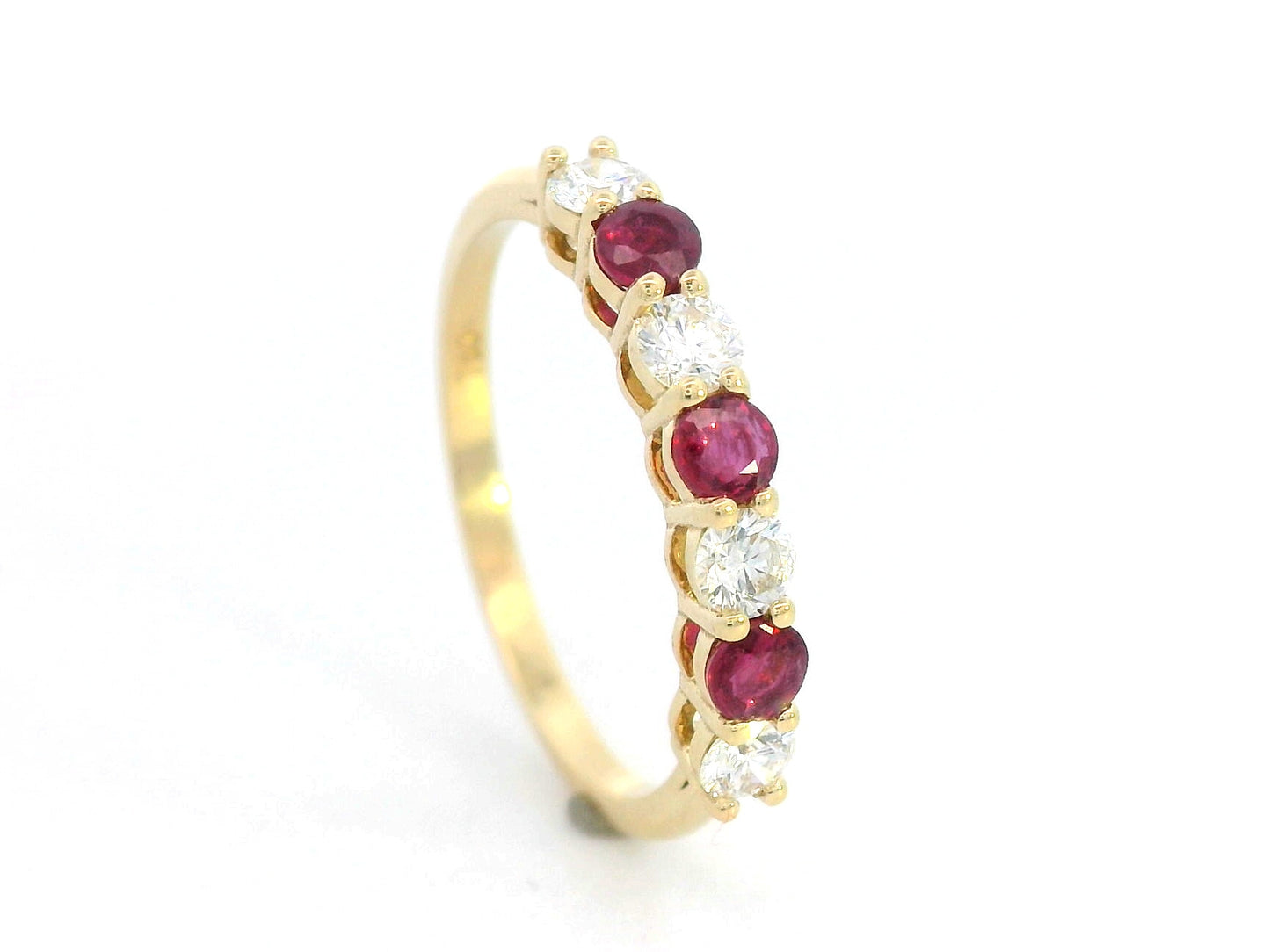 18K yellow gold ring with alternating rubies and diamonds, elegant half-eternity band design.
