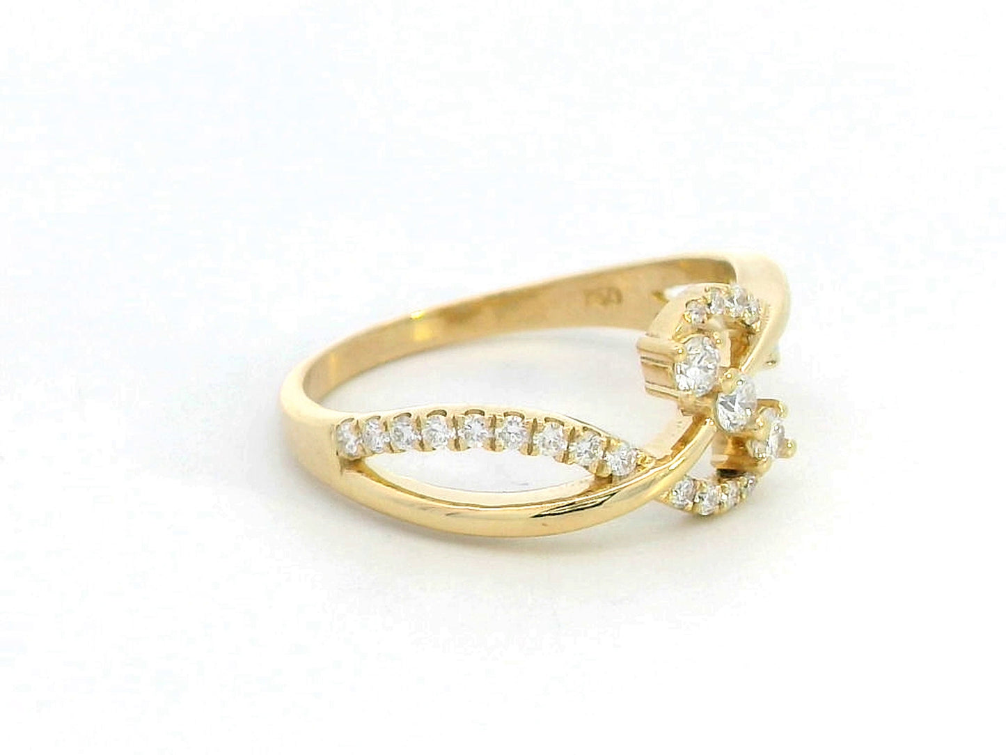 18K gold infinity twist ring with 0.33 carats of round diamonds in an elegant crossover design