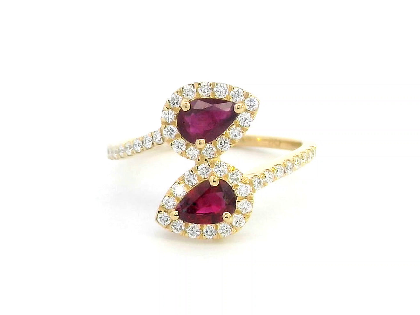 Double pear ruby and diamond bypass ring in 18K gold with halo setting – 0.80ct rubies and 0.39ct diamonds