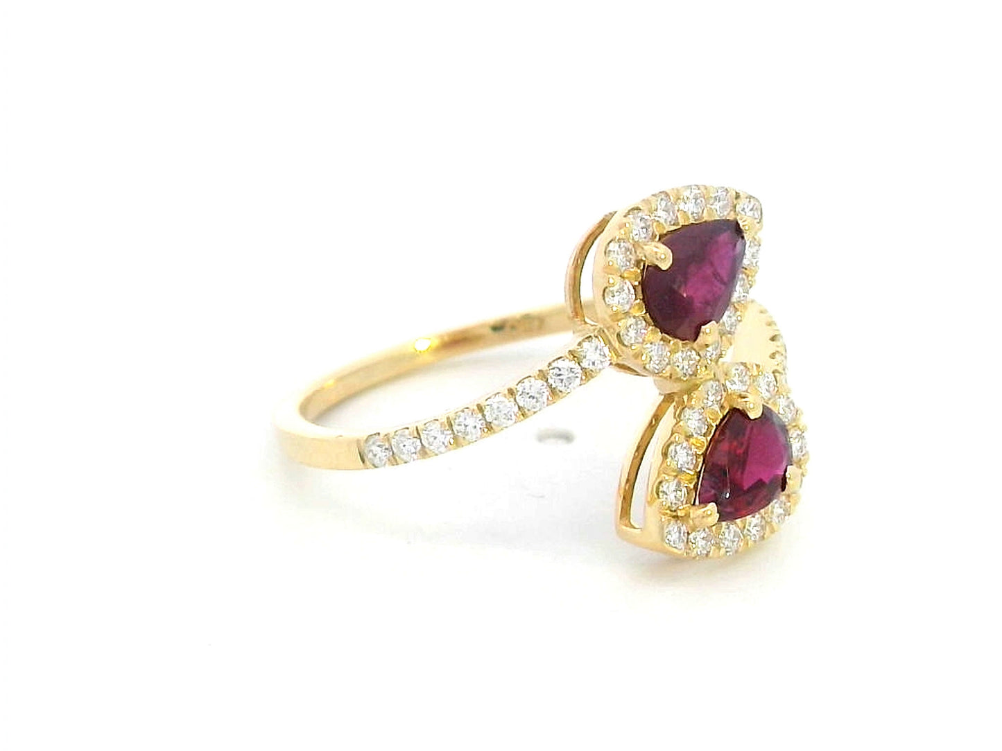 Double pear ruby and diamond bypass ring in 18K gold with halo setting – 0.80ct rubies and 0.39ct diamonds