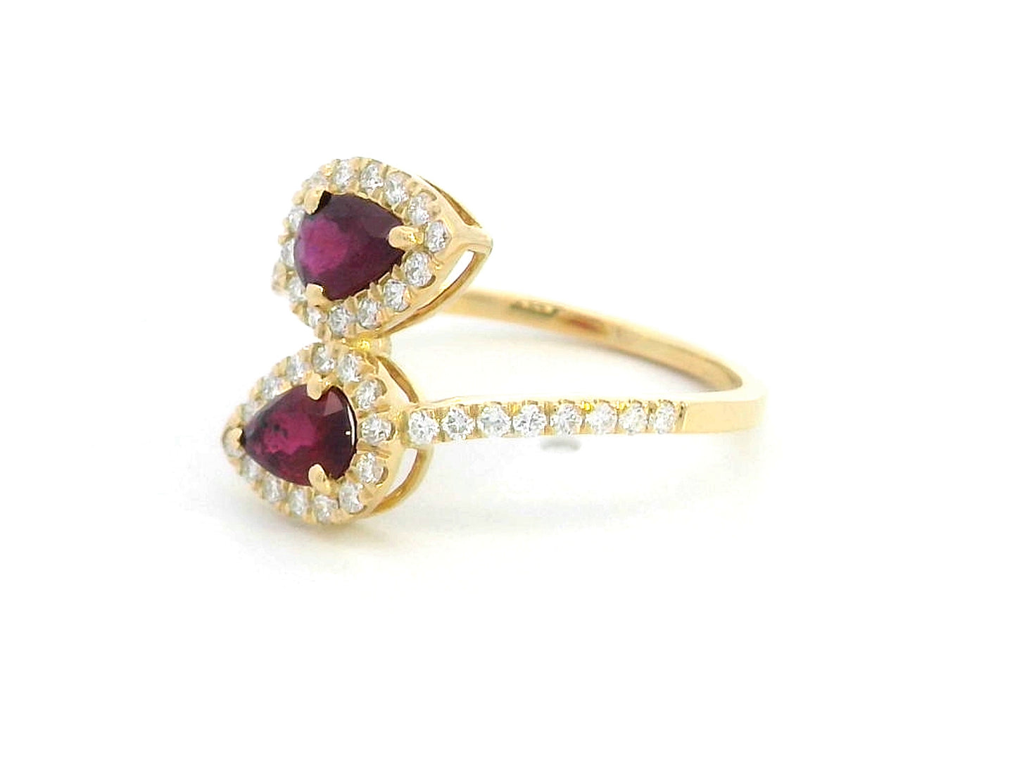 Double pear ruby and diamond bypass ring in 18K gold with halo setting – 0.80ct rubies and 0.39ct diamonds