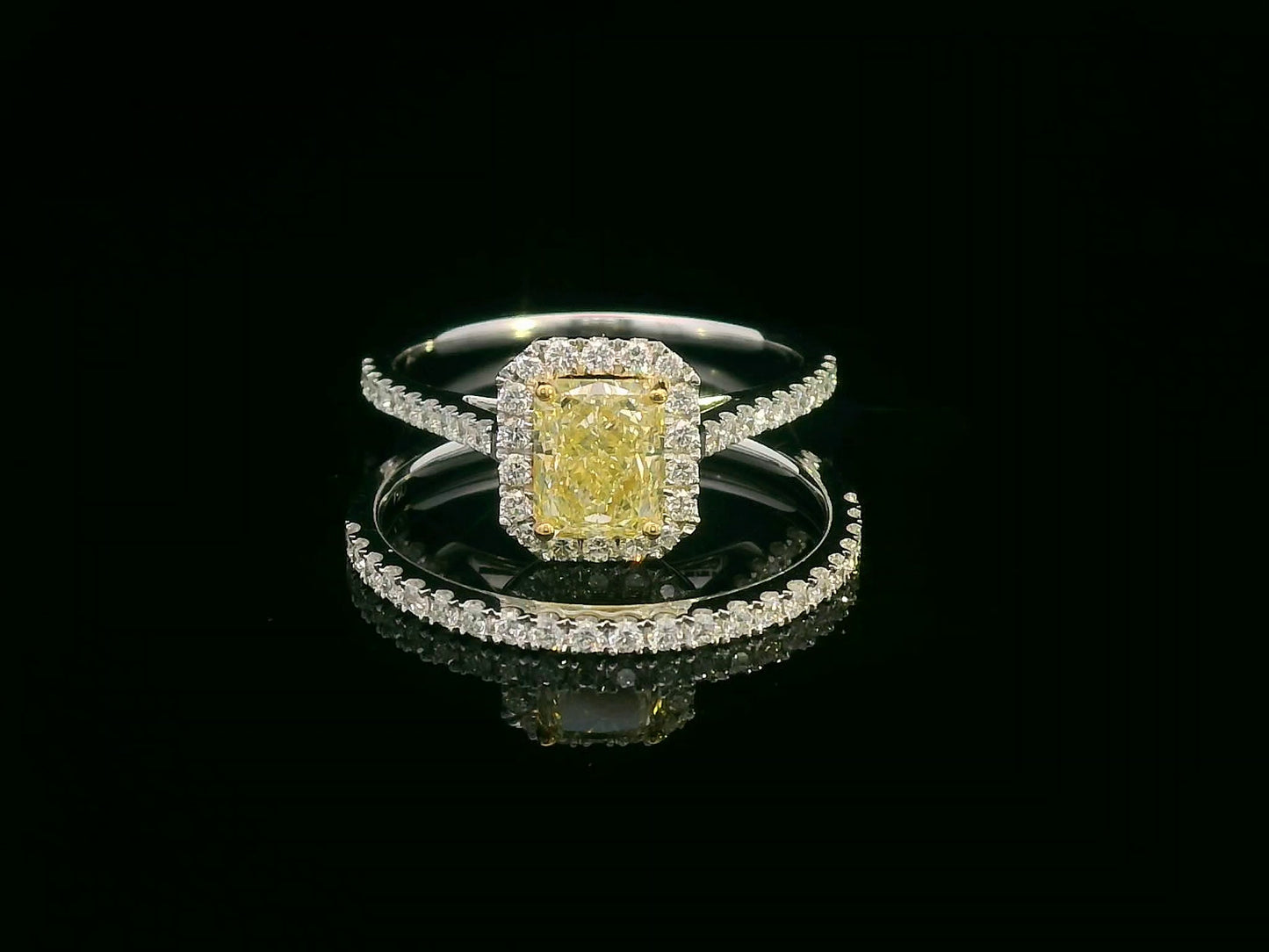Bridal set with 1.08 carat radiant-cut fancy yellow diamond and 0.53 carat white diamonds in 18K gold