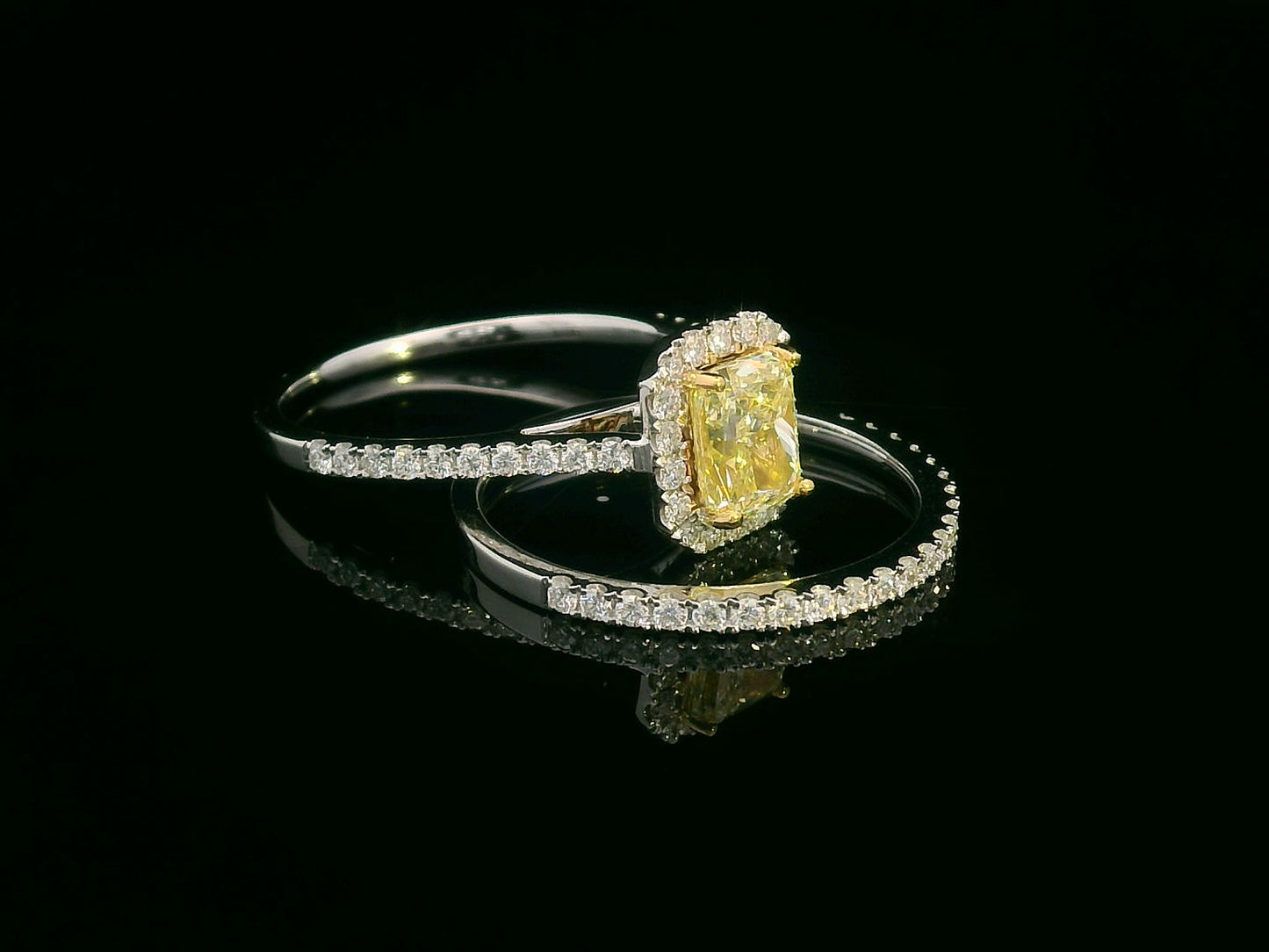 Bridal set with 1.08 carat radiant-cut fancy yellow diamond and 0.53 carat white diamonds in 18K gold