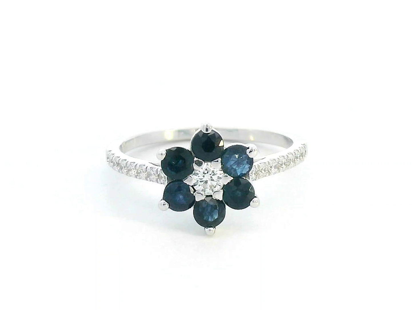 Floral ring in 18K gold with round blue sapphires and diamond center, pavé diamond band, total 0.91ct sapphires and 0.29ct diamonds.