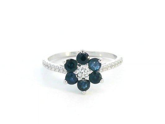 Floral ring in 18K gold with round blue sapphires and diamond center, pavé diamond band, total 0.91ct sapphires and 0.29ct diamonds.