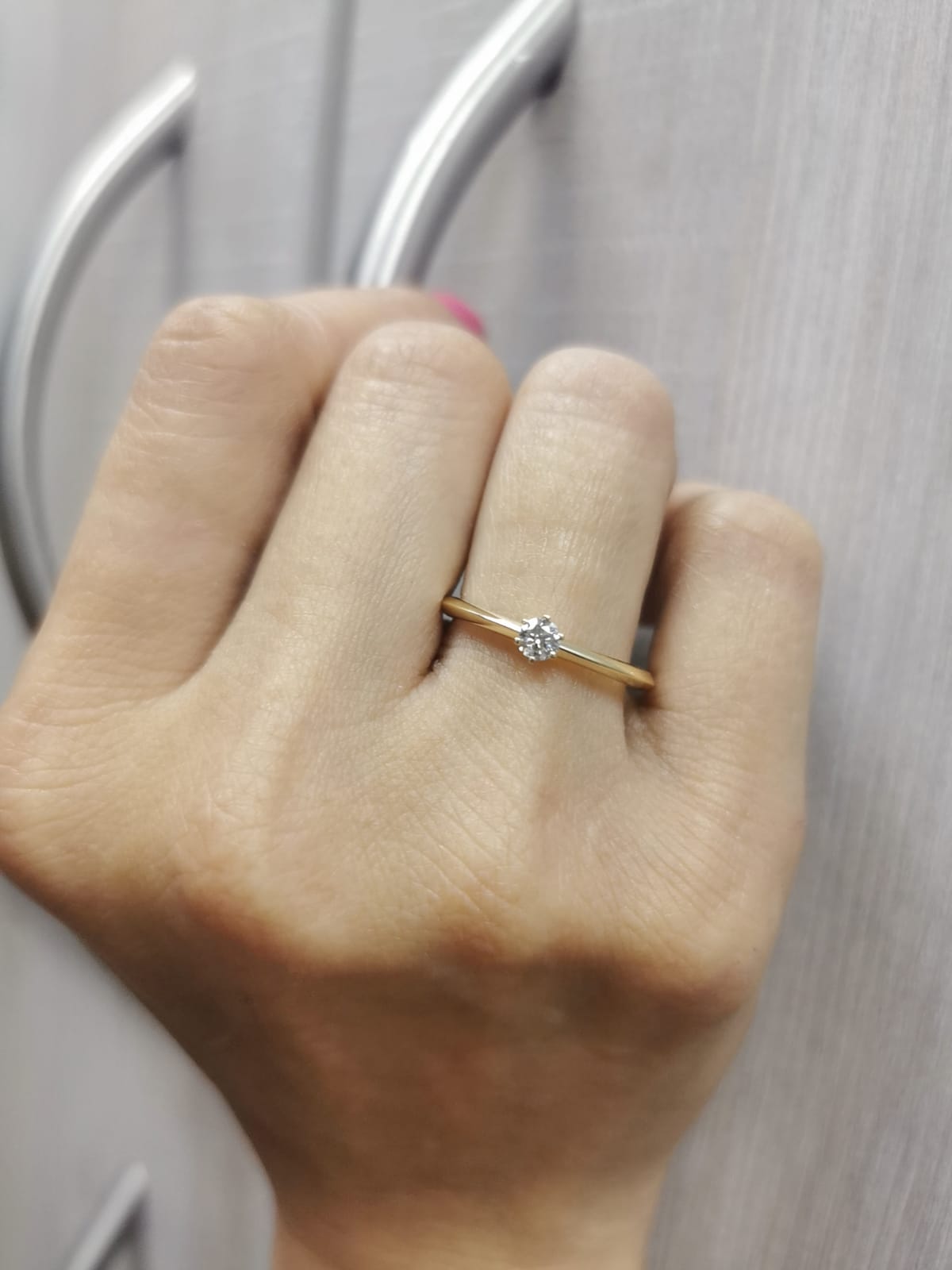 18K yellow gold knife-edge solitaire ring with 0.15 carat round diamond in six-prong setting