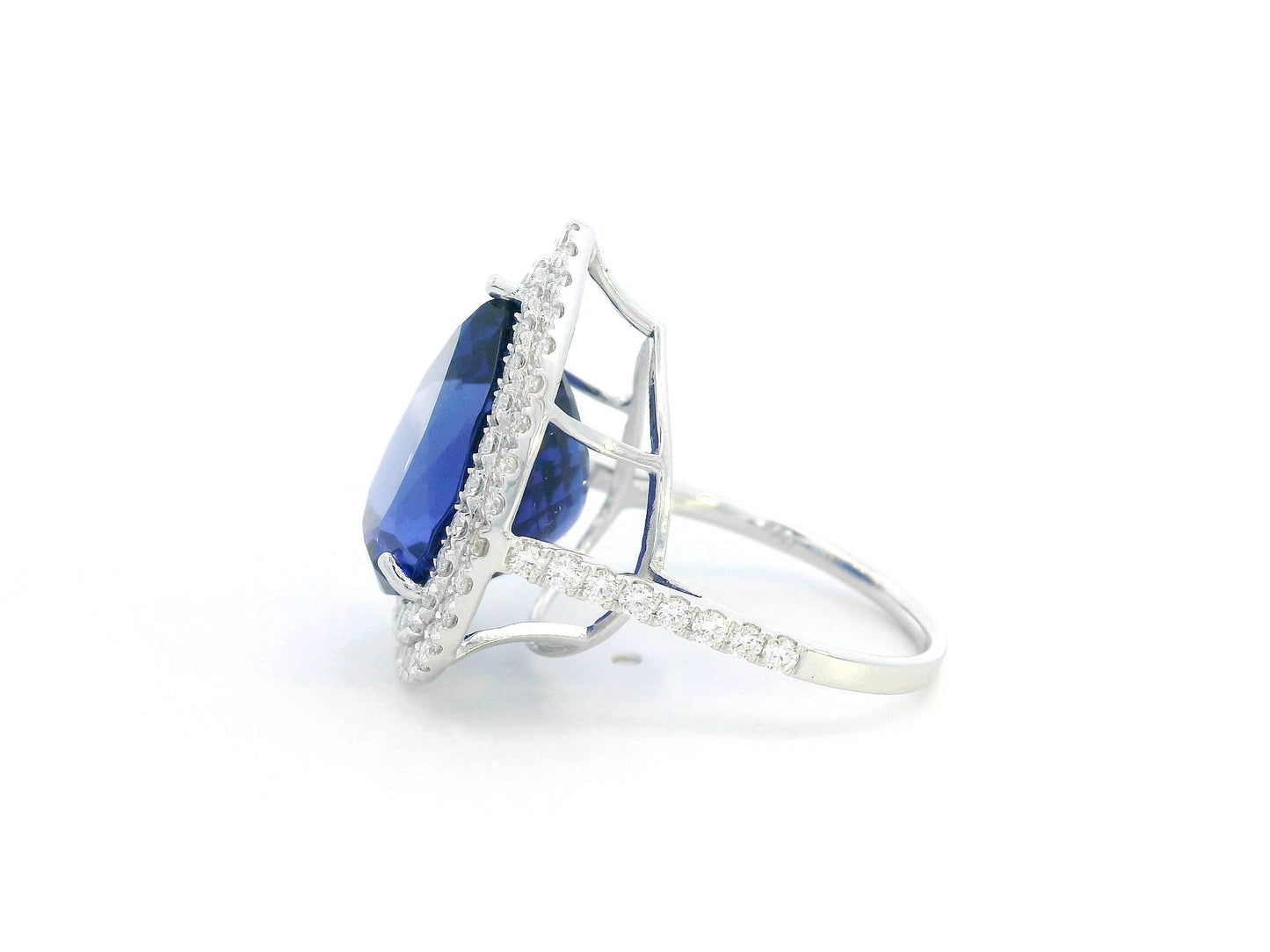Pear-shaped tanzanite cocktail ring with double diamond halo in 18K gold