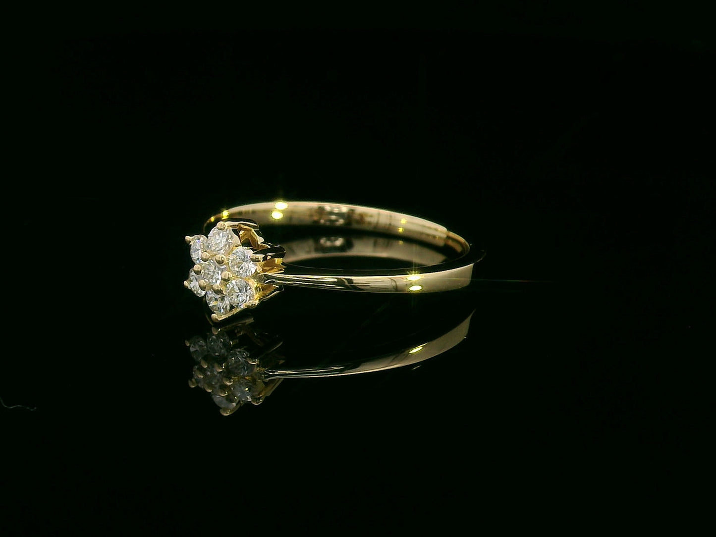 Floral diamond cluster ring in 18K yellow gold with 0.21 carat round brilliant diamonds