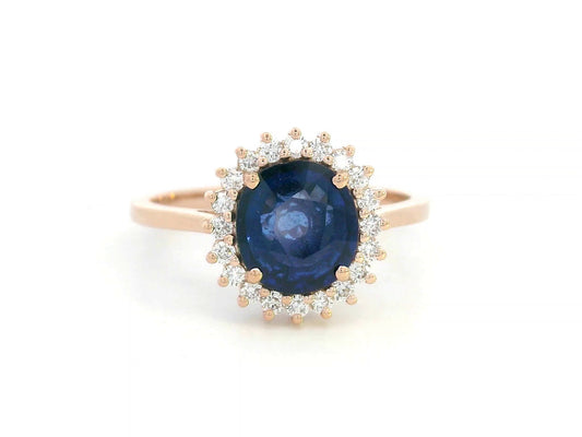 Blue sapphire and diamond halo ring in 18K rose gold with 2.02 carat sapphire and vintage-inspired setting