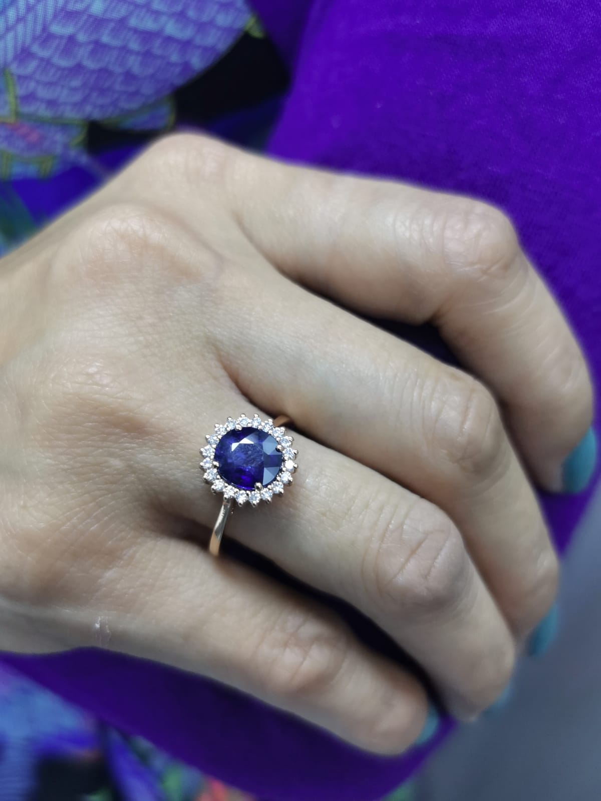 Blue sapphire and diamond halo ring in 18K rose gold with 2.02 carat sapphire and vintage-inspired setting