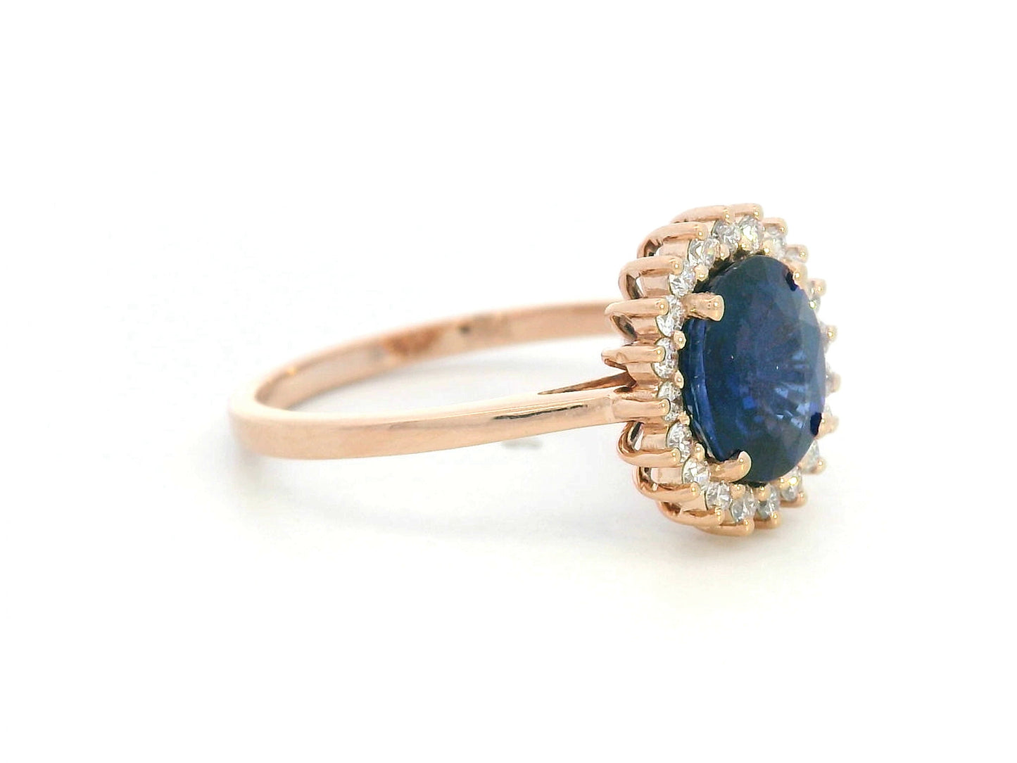 Blue sapphire and diamond halo ring in 18K rose gold with 2.02 carat sapphire and vintage-inspired setting
