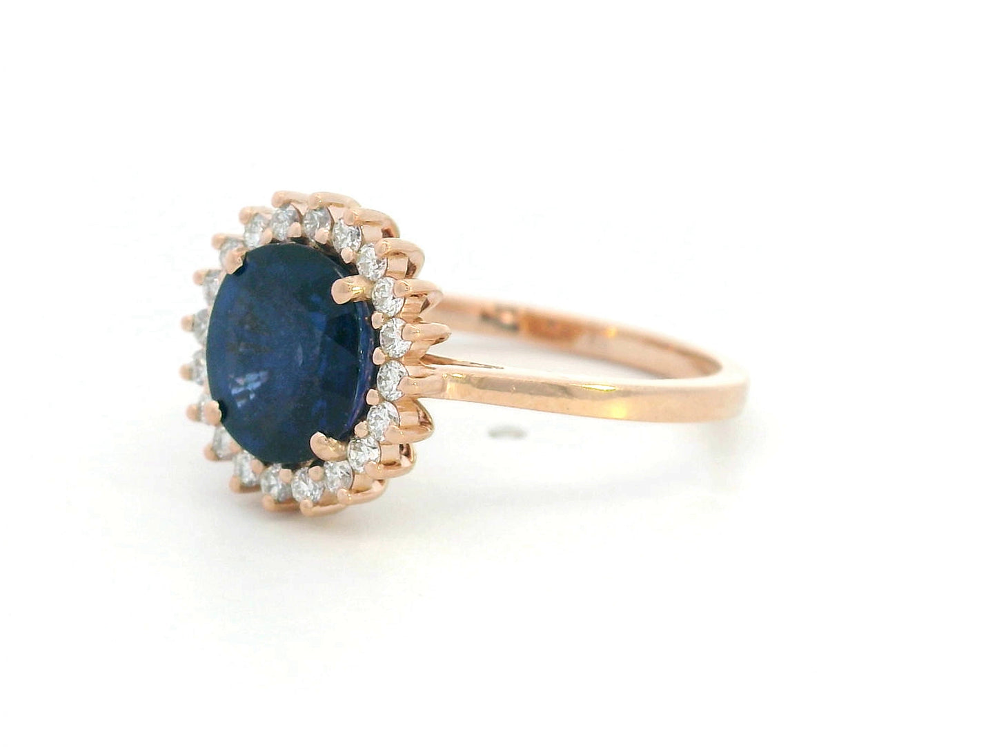Blue sapphire and diamond halo ring in 18K rose gold with 2.02 carat sapphire and vintage-inspired setting