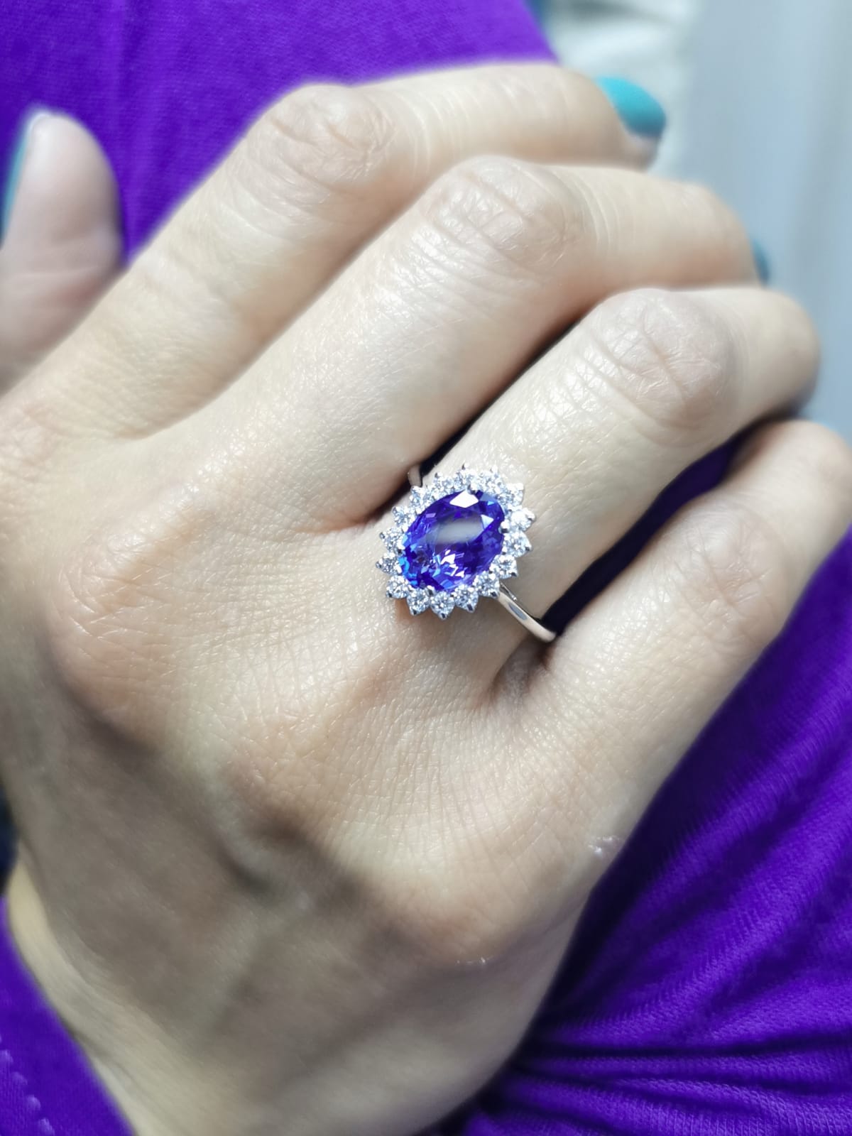 Oval-cut 1.99 carat tanzanite ring with diamond halo in 18K white gold inspired by Princess Diana
