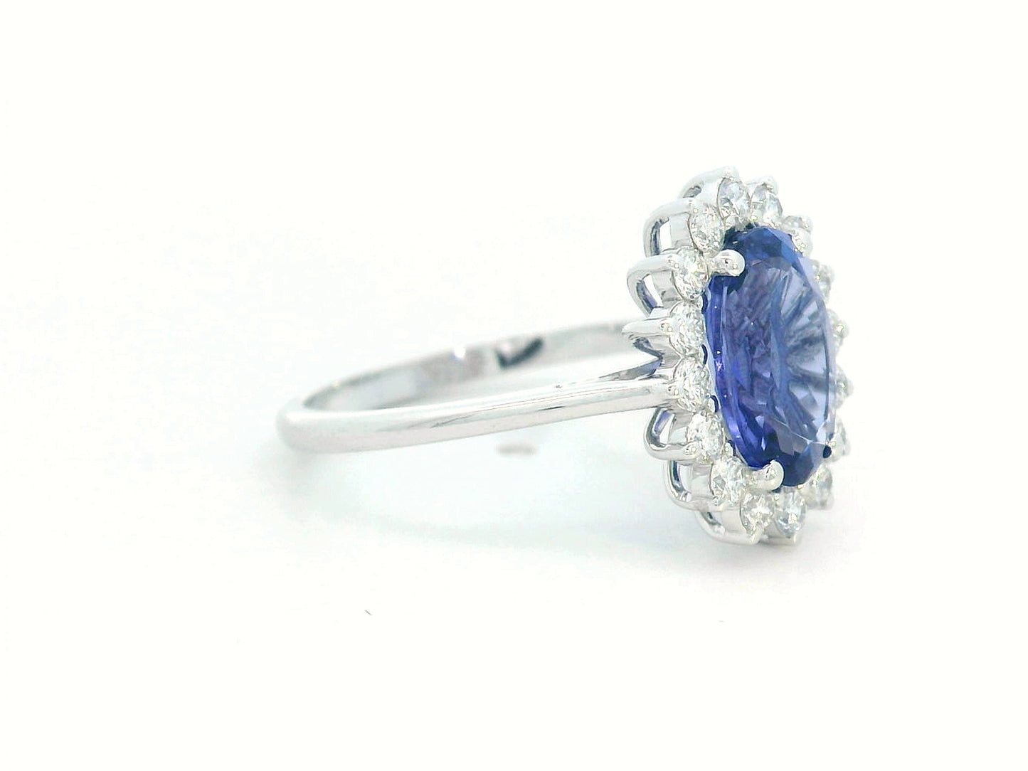 Oval-cut 1.99 carat tanzanite ring with diamond halo in 18K white gold inspired by Princess Diana
