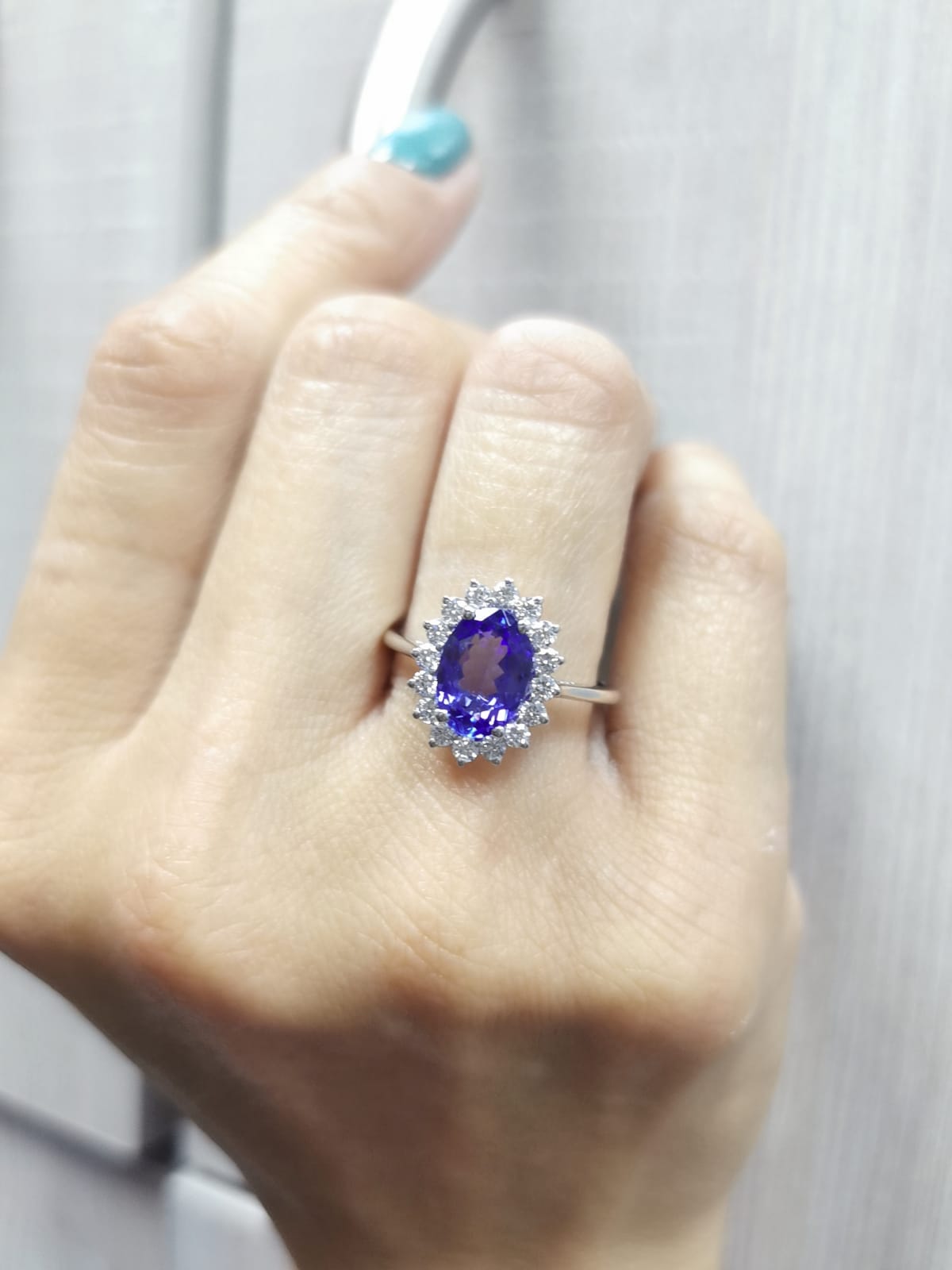 Oval-cut 1.99 carat tanzanite ring with diamond halo in 18K white gold inspired by Princess Diana