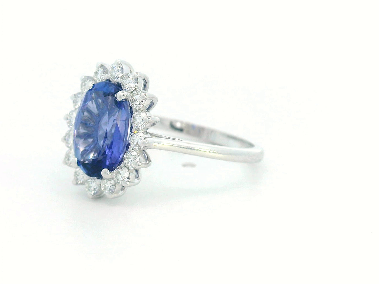 Oval-cut 1.99 carat tanzanite ring with diamond halo in 18K white gold inspired by Princess Diana