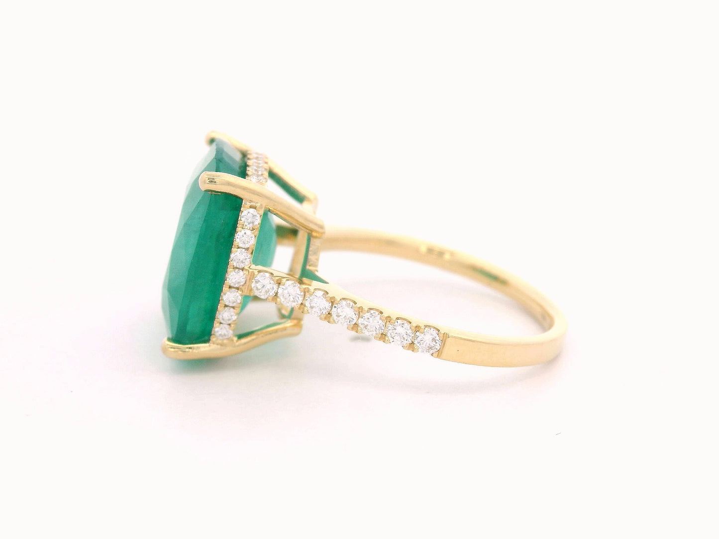 9.01 carat cushion-cut emerald ring in 18K yellow gold with hidden halo and diamond pavé band