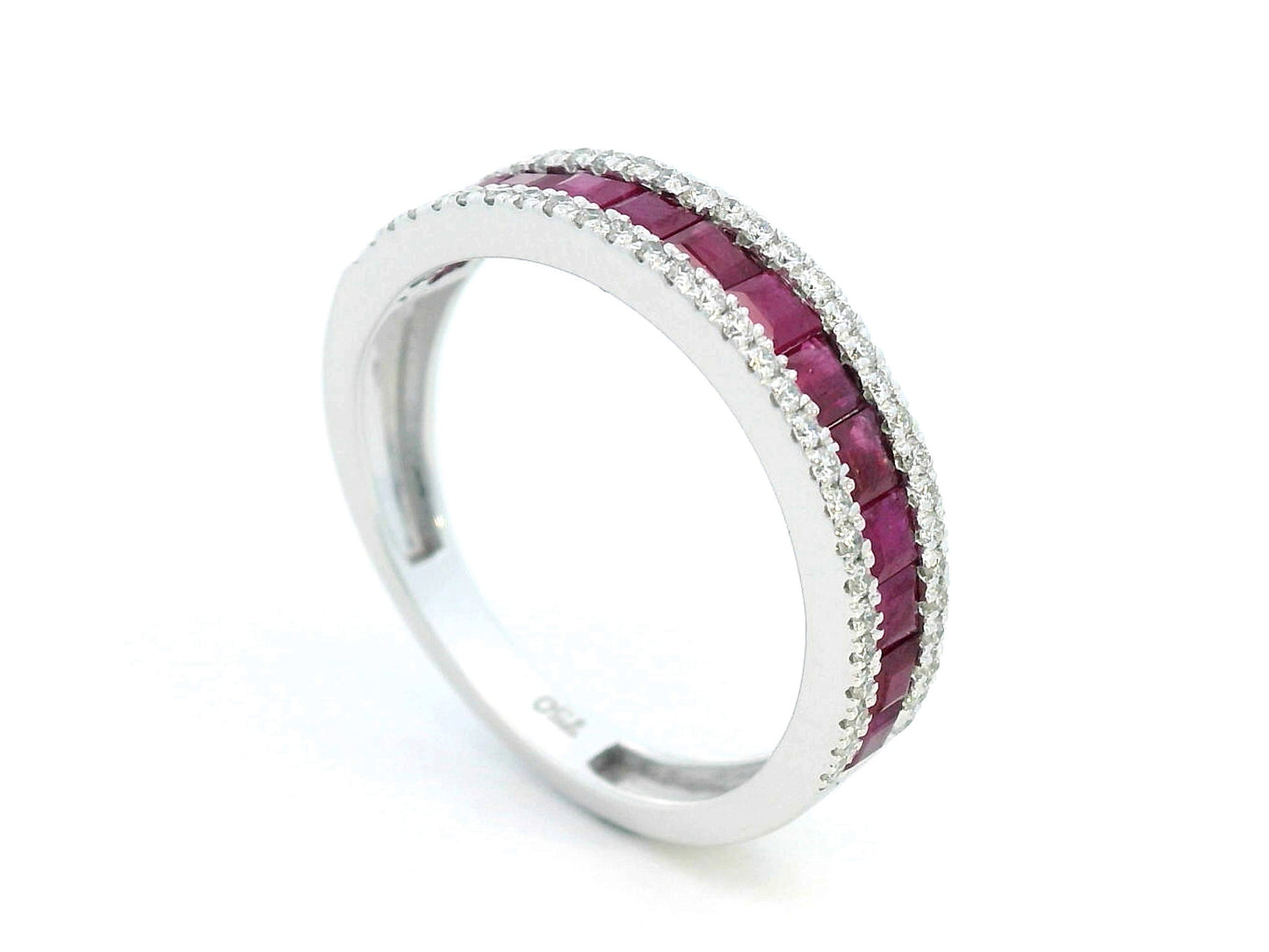 18K gold ruby and diamond ring with 1.36ct baguette-cut rubies and 0.26ct round diamonds in modern channel setting.