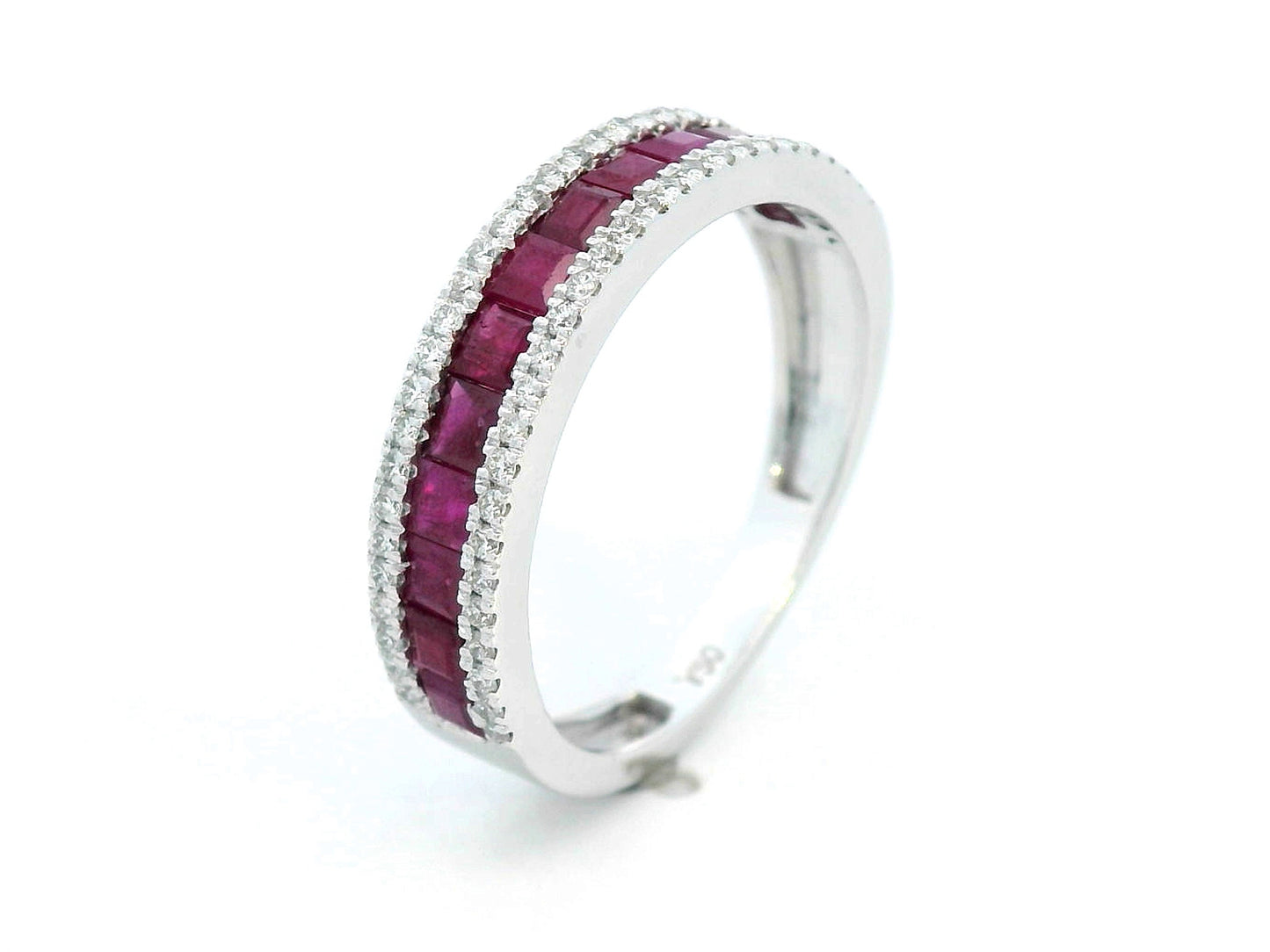 18K gold ruby and diamond ring with 1.36ct baguette-cut rubies and 0.26ct round diamonds in modern channel setting.