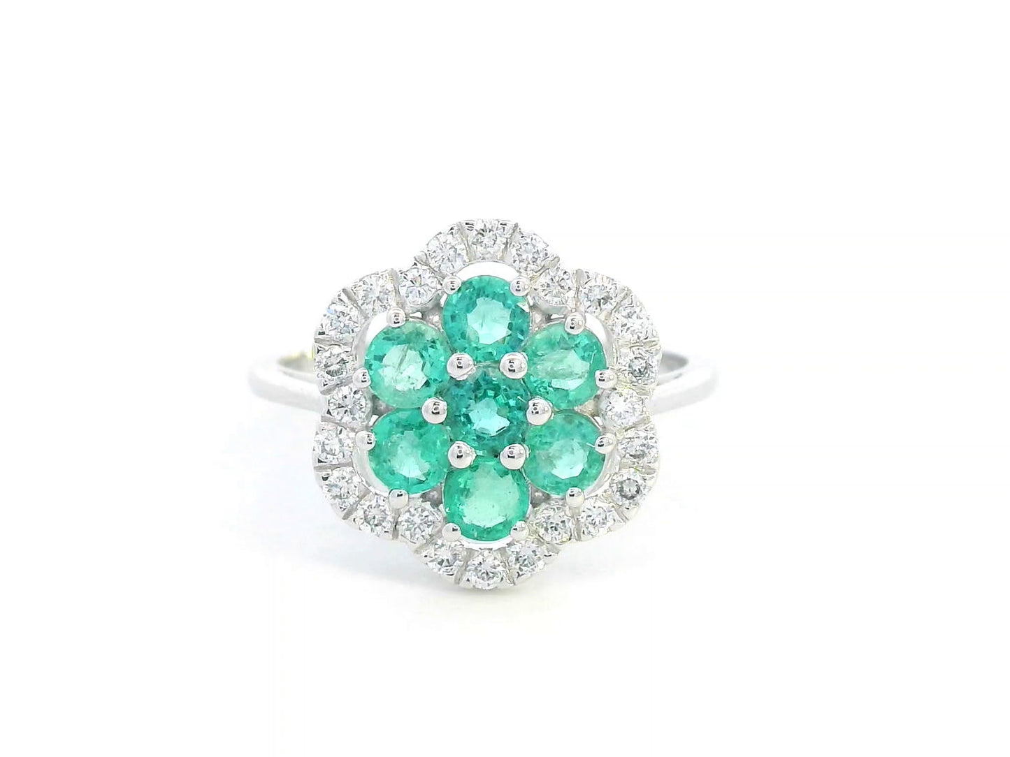 Floral emerald cluster and diamond halo ring in 18K gold