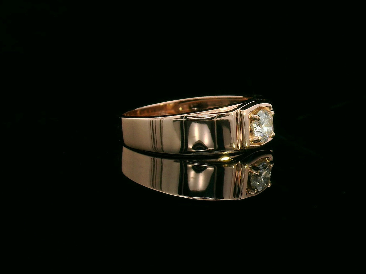 Men’s 18K gold solitaire ring with 0.32 carat diamond in four-prong setting, wide band design