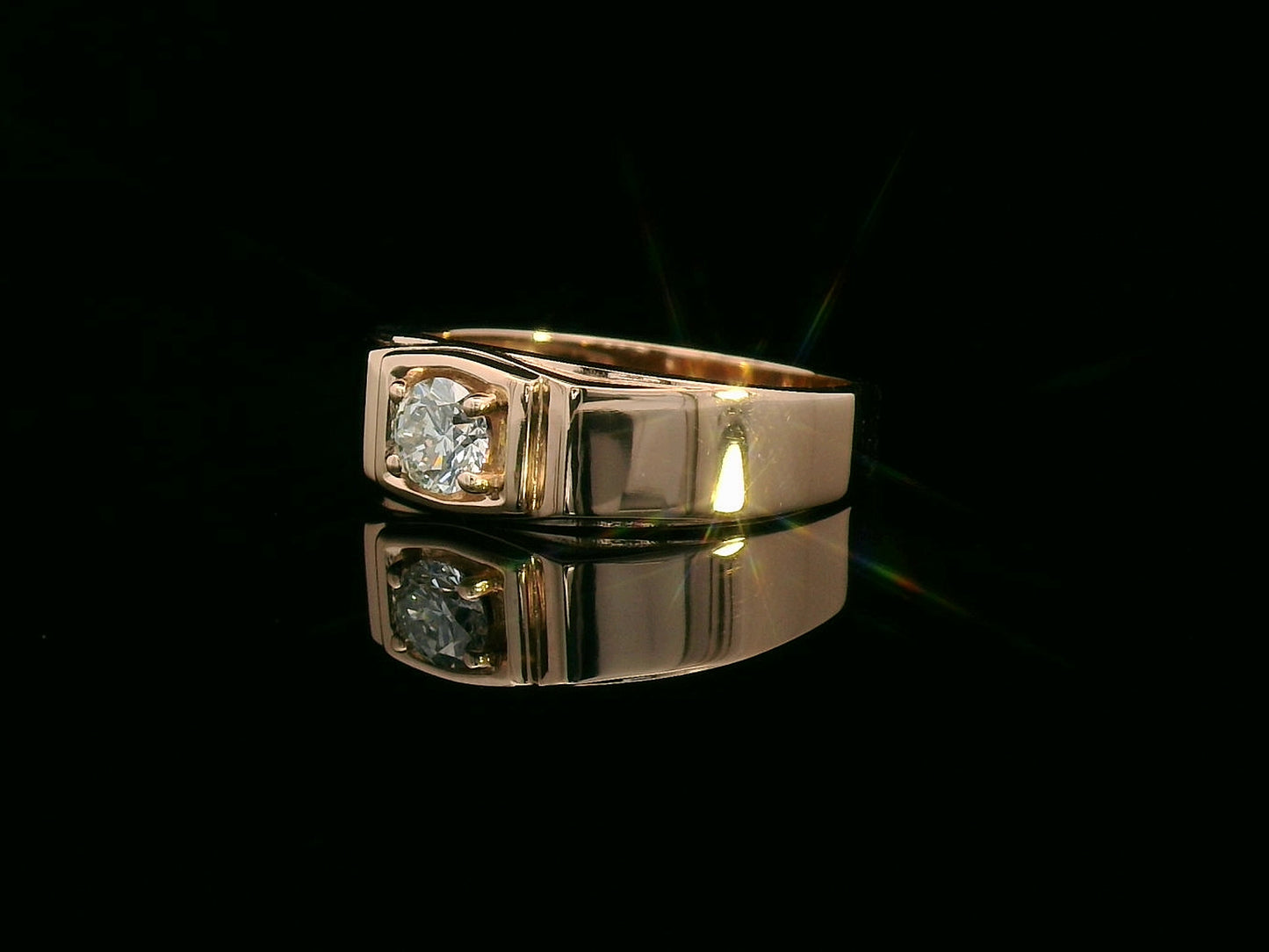 Men’s 18K gold solitaire ring with 0.32 carat diamond in four-prong setting, wide band design