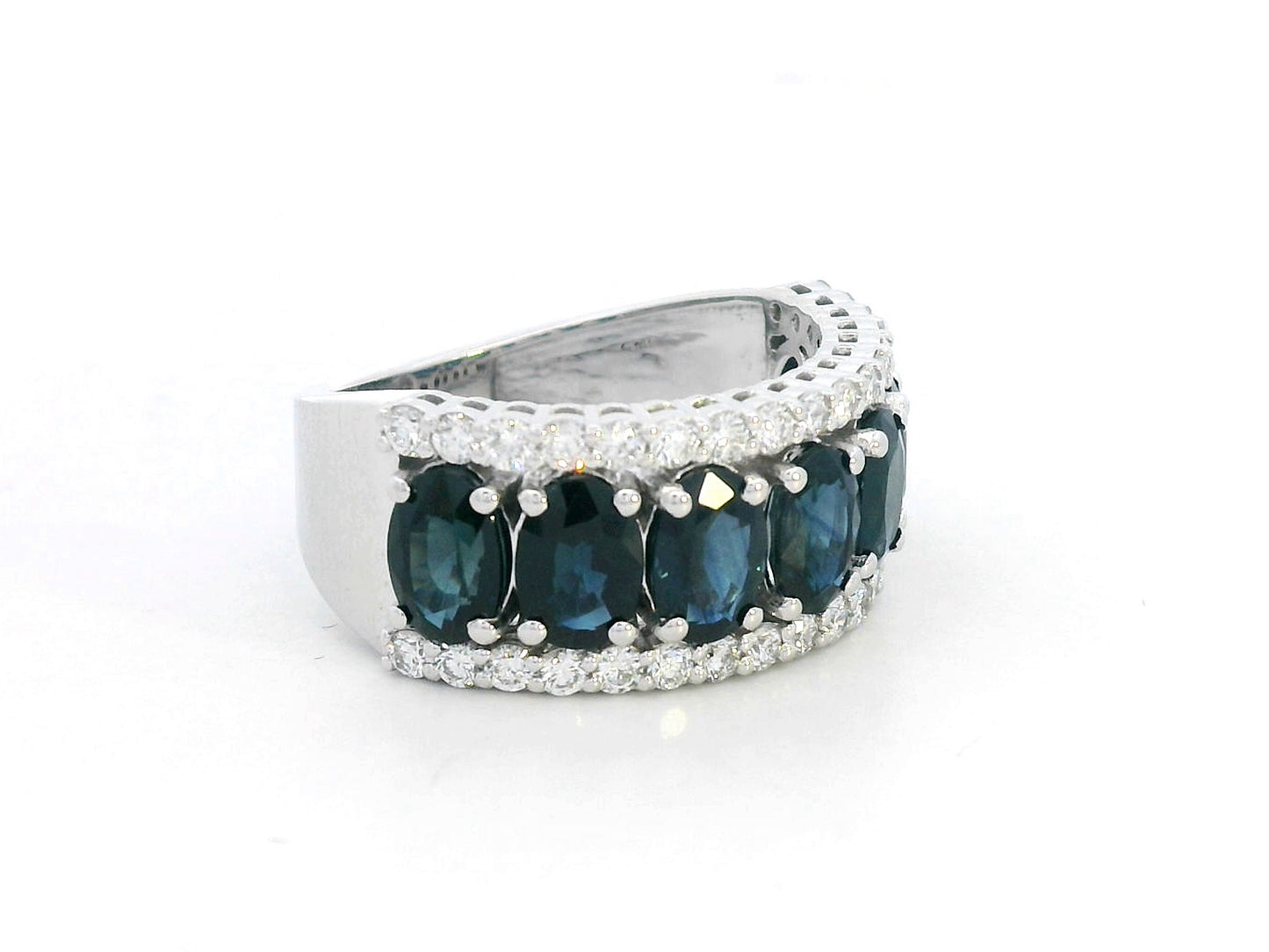 18K white gold wide band ring with oval blue sapphires and round diamond borders – Emirates Diamonds
