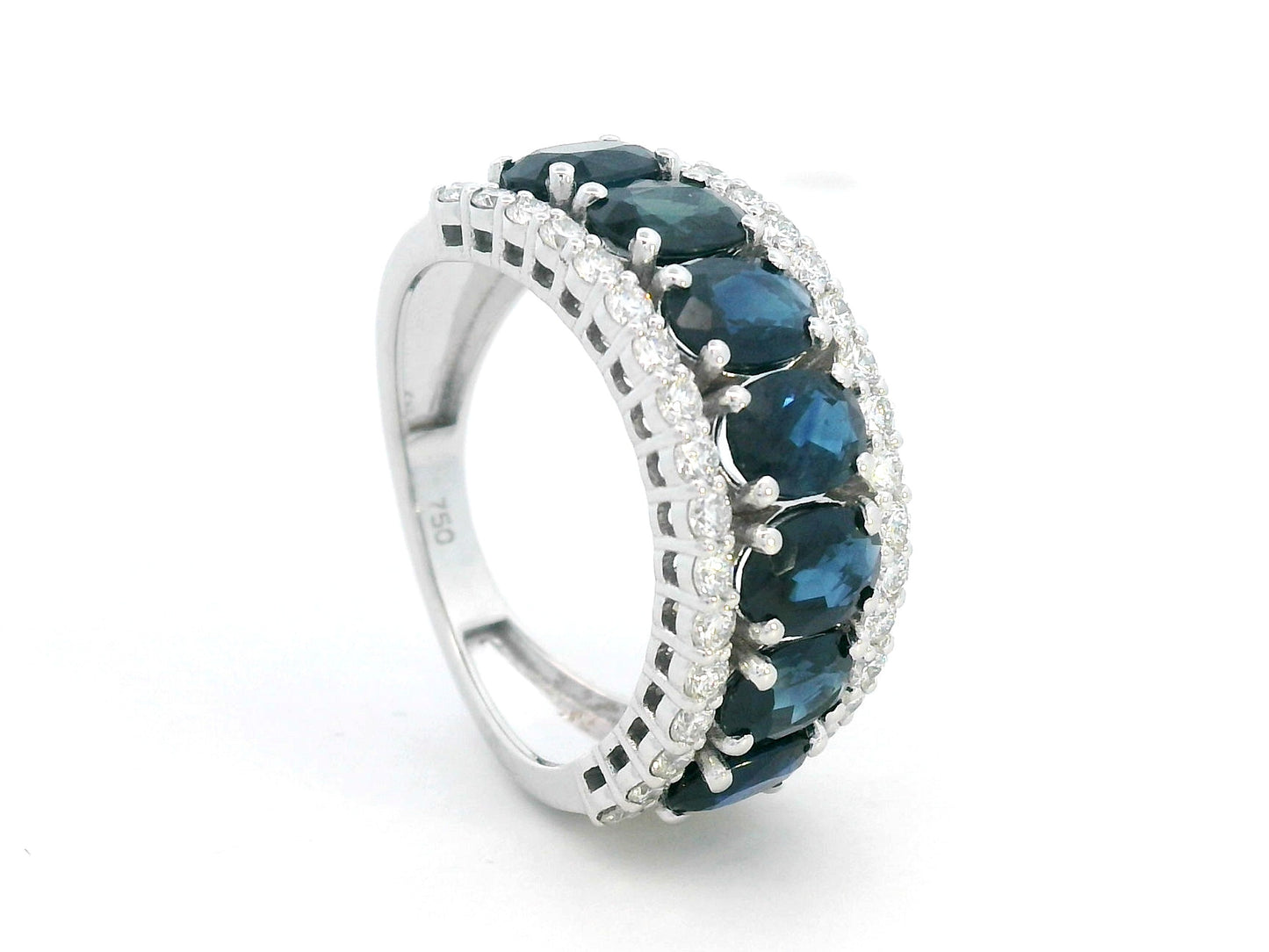 18K white gold wide band ring with oval blue sapphires and round diamond borders – Emirates Diamonds