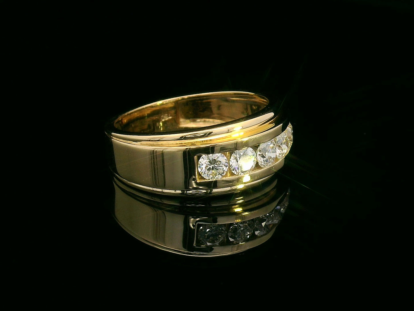 Men’s 18K yellow gold ring with five channel-set round diamonds, 0.97 carat total.