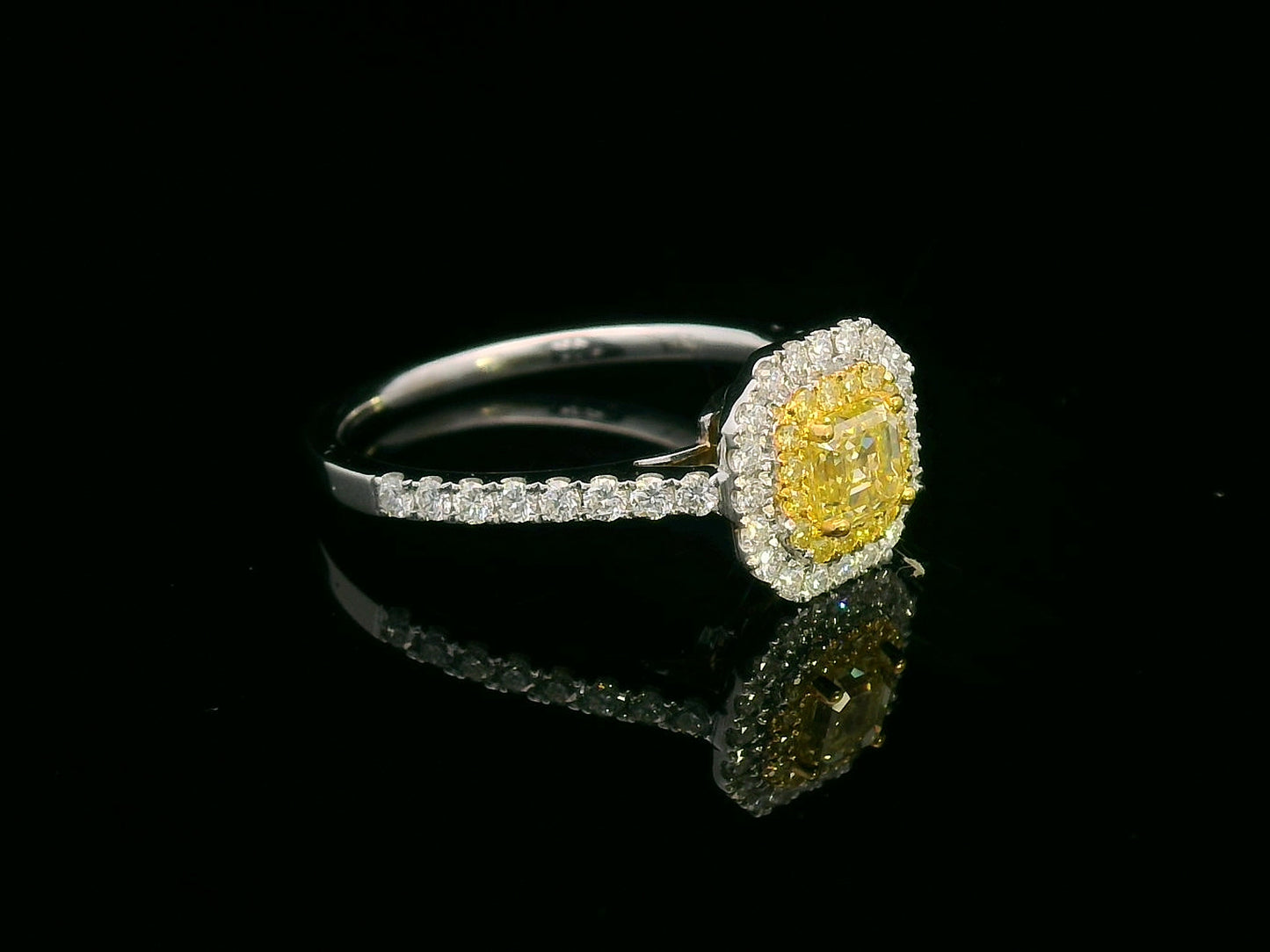 Asscher cut fancy yellow diamond ring with dual halo in 18K gold featuring yellow and white diamonds