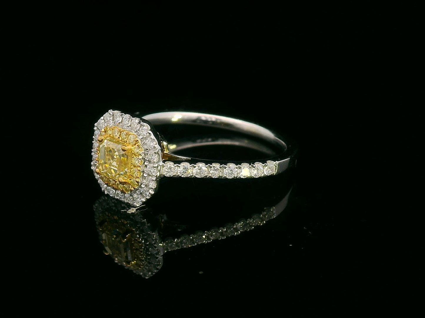 Asscher cut fancy yellow diamond ring with dual halo in 18K gold featuring yellow and white diamonds