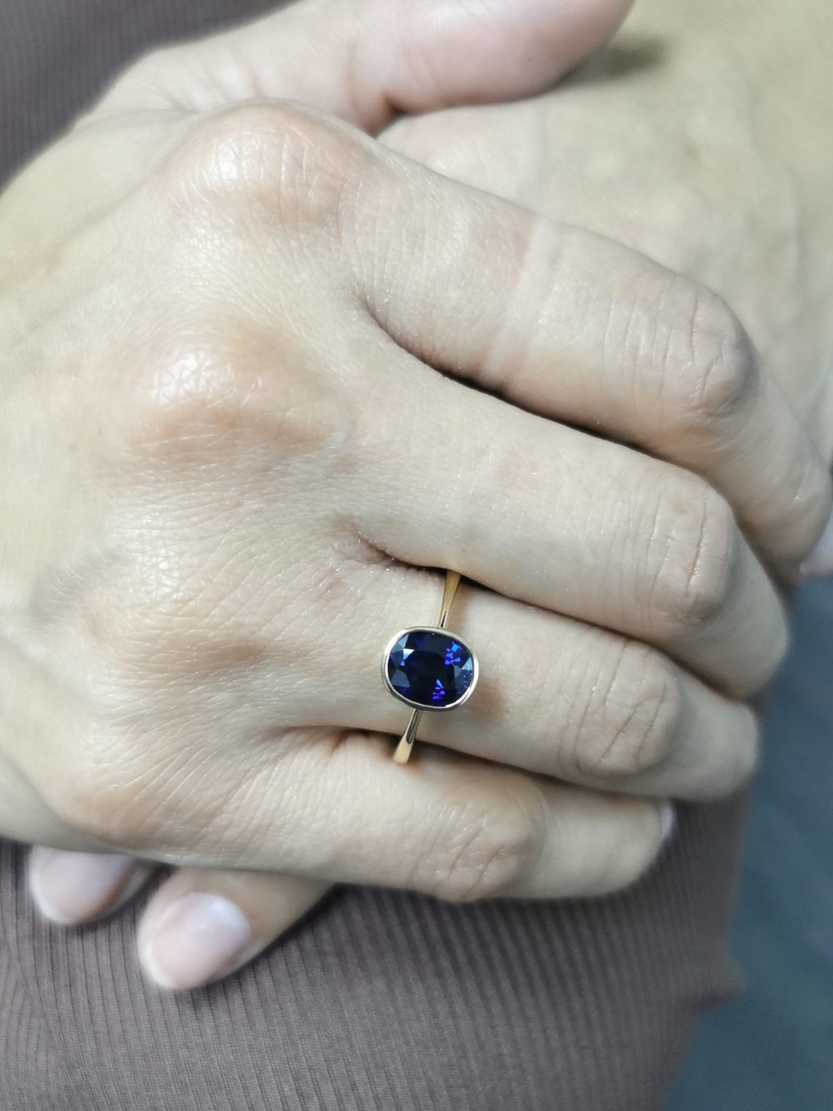 Round cut 2.14 carat Blue Sapphire ring in bezel setting, 18K yellow gold