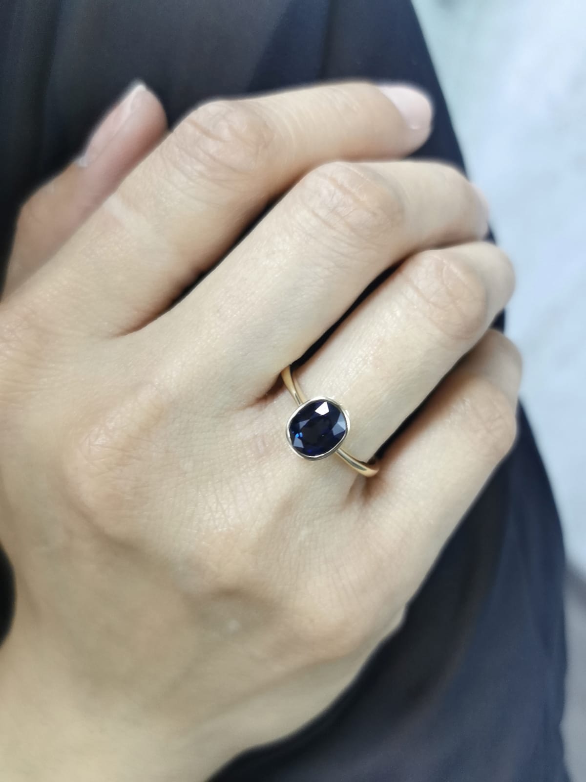 Round cut 2.14 carat Blue Sapphire ring in bezel setting, 18K yellow gold
