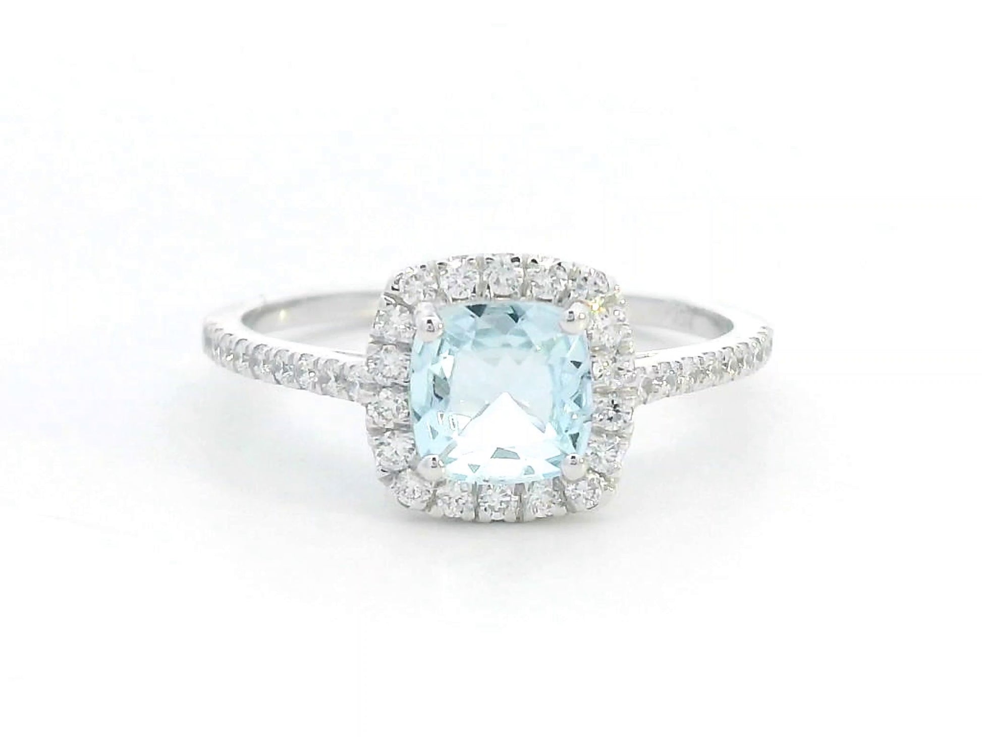 18K white gold ring with cushion-cut aquamarine center and diamond halo and band