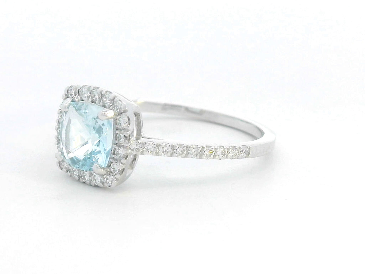 18K white gold ring with cushion-cut aquamarine center and diamond halo and band