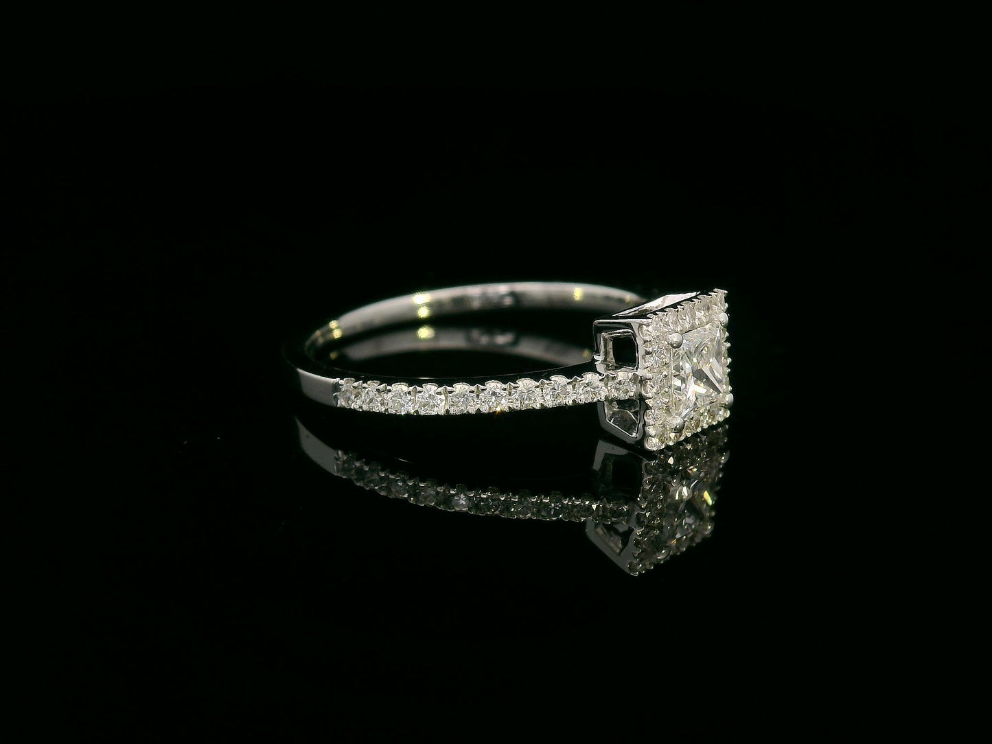18K White Gold Princess Cut Diamond Halo Ring with 0.31ct center and 0.29ct accent diamonds