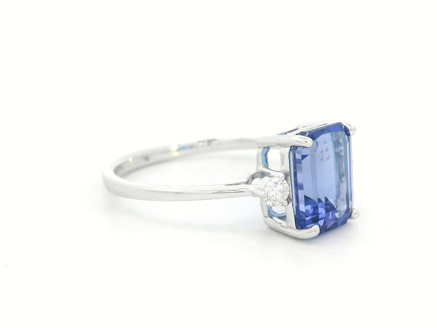 18K white gold ring with 3.08 carat emerald-cut Tanzanite and round diamond accents on the sides