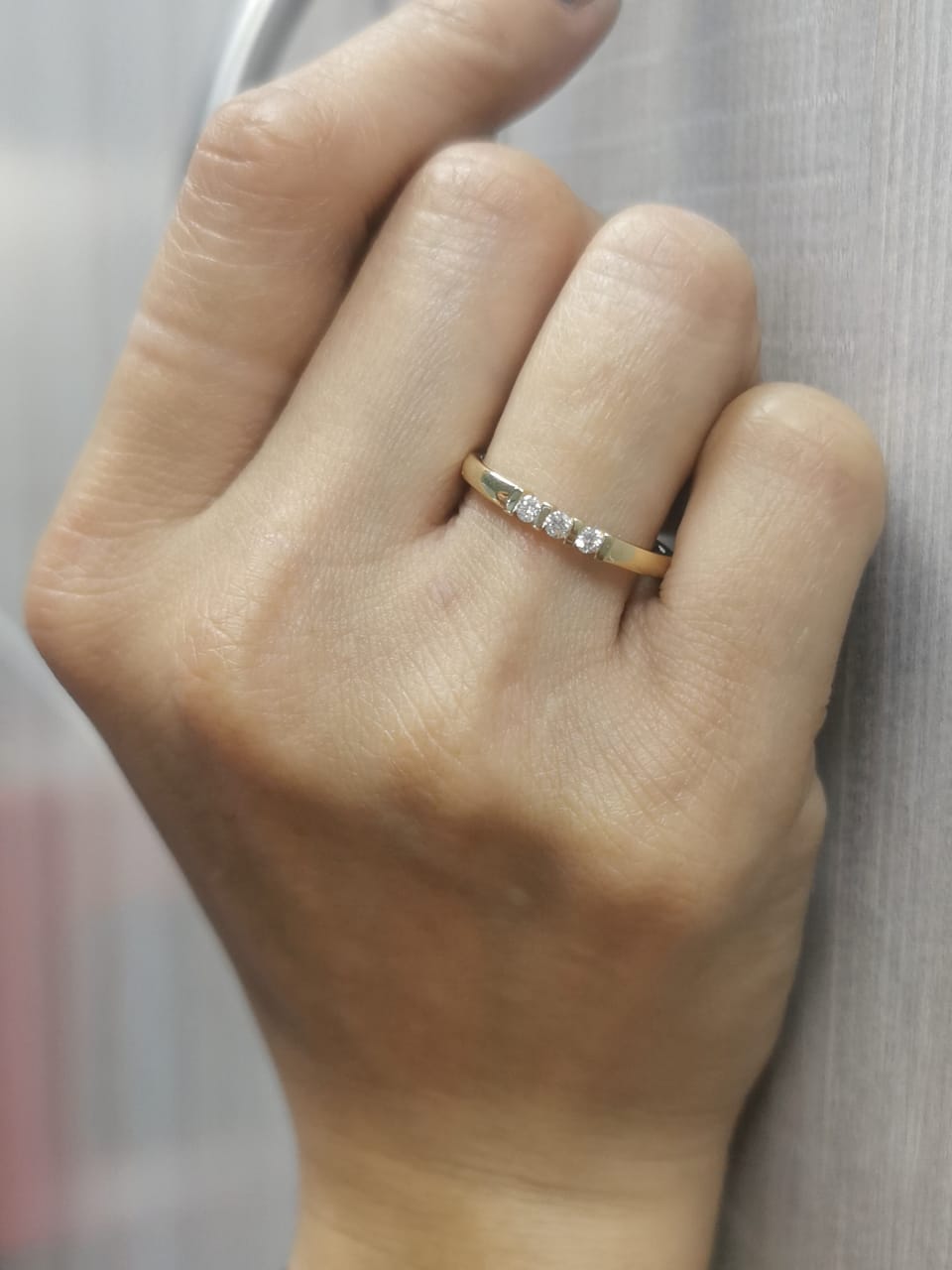 18K yellow gold ring with three round diamonds separated by gold bars – minimalist trilogy design