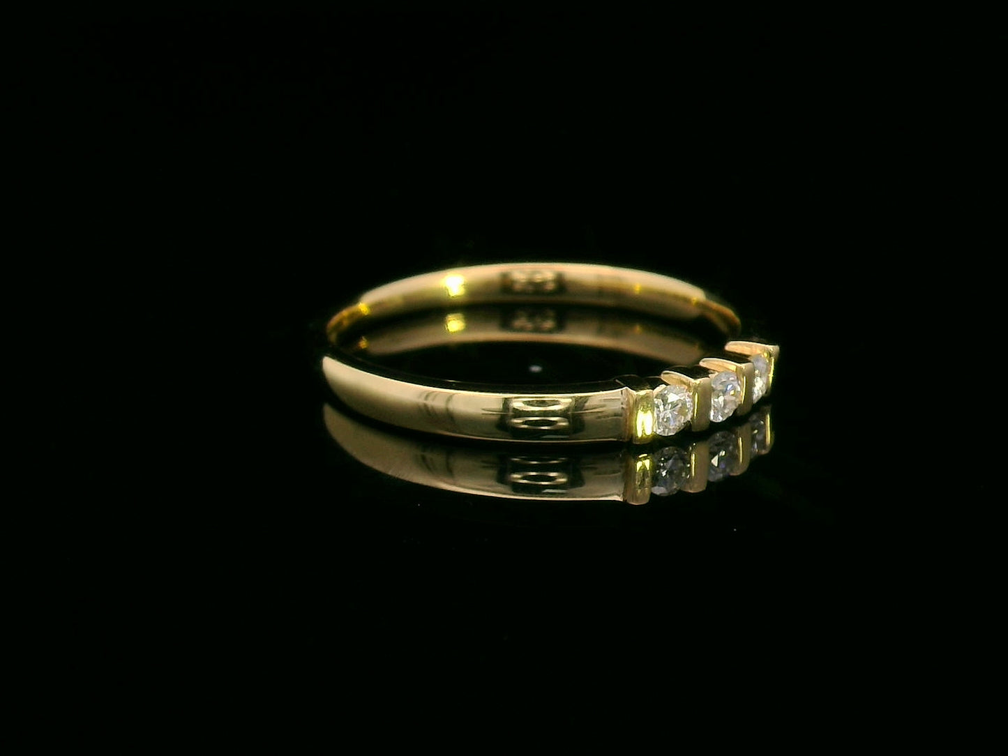 18K yellow gold ring with three round diamonds separated by gold bars – minimalist trilogy design