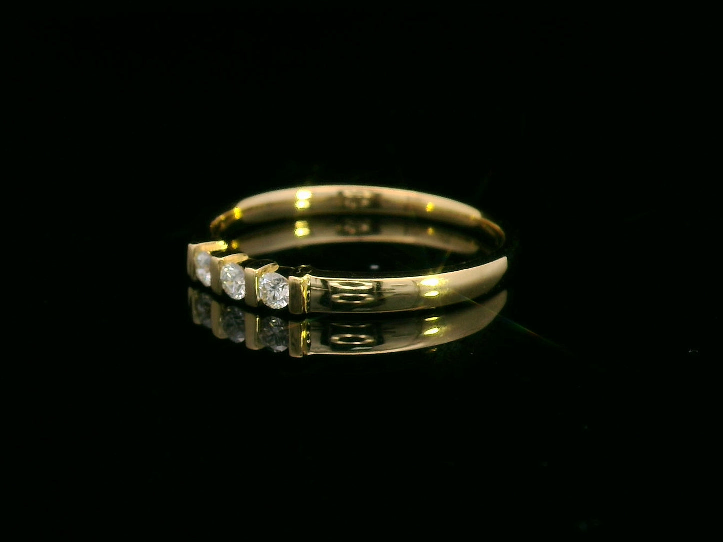 18K yellow gold ring with three round diamonds separated by gold bars – minimalist trilogy design