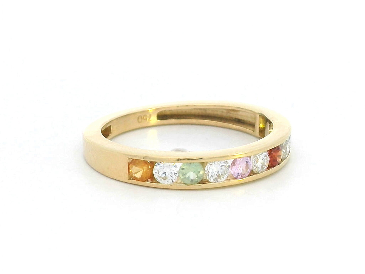 18K yellow gold band with alternating multi-color sapphires and round-cut diamonds in a channel setting