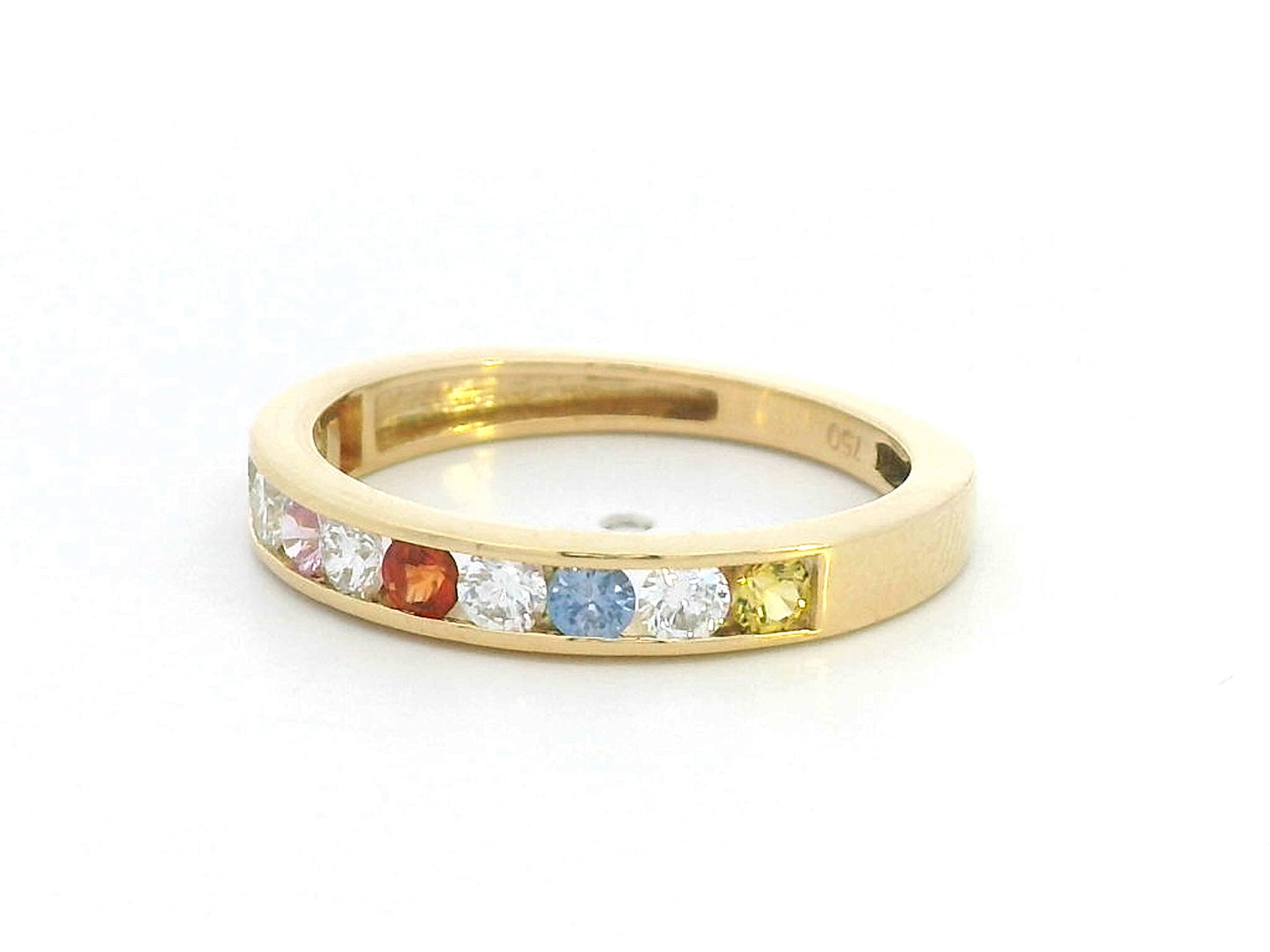 18K yellow gold band with alternating multi-color sapphires and round-cut diamonds in a channel setting
