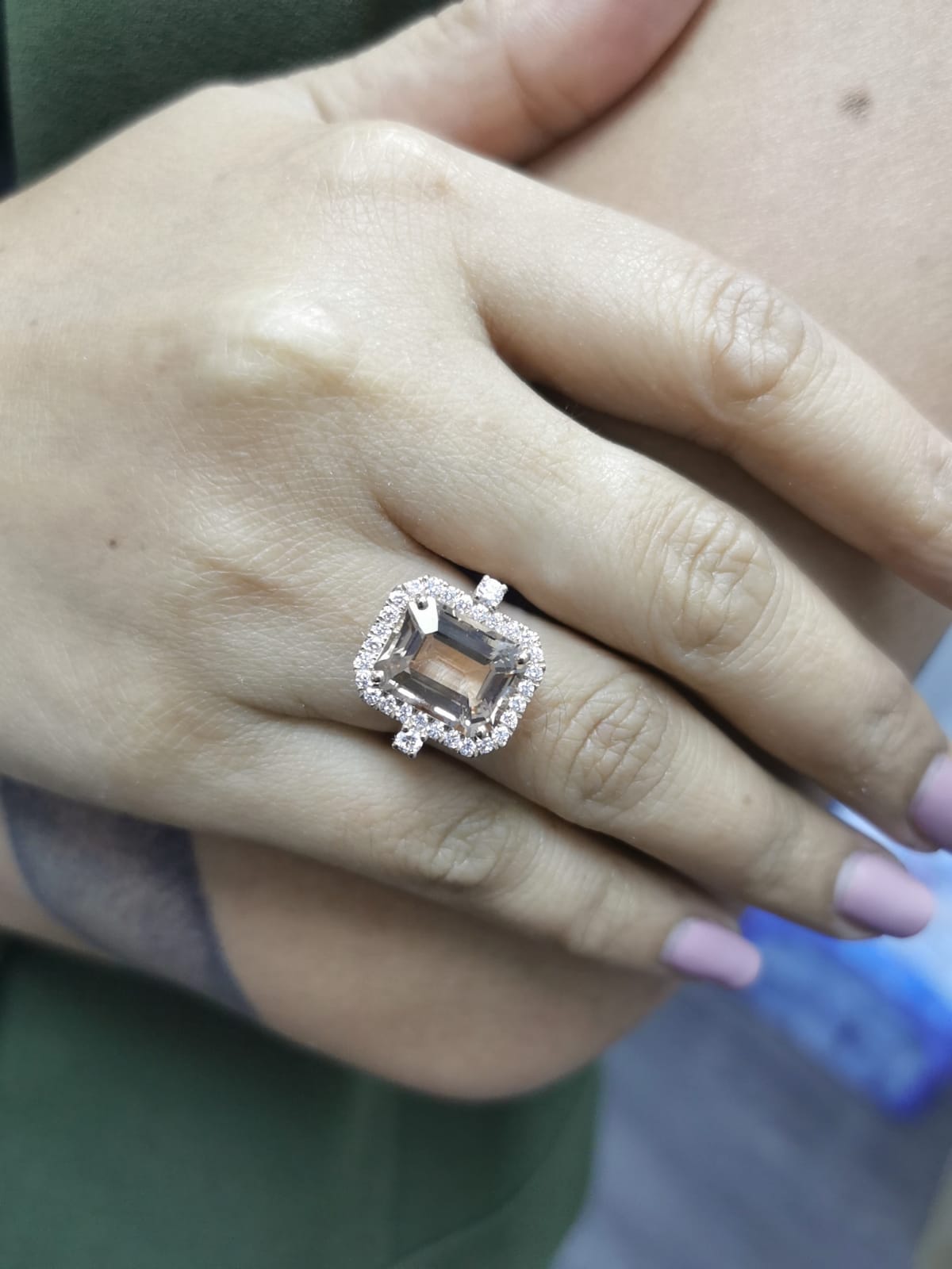 Emerald-cut morganite halo ring with round diamonds in 18K rose gold