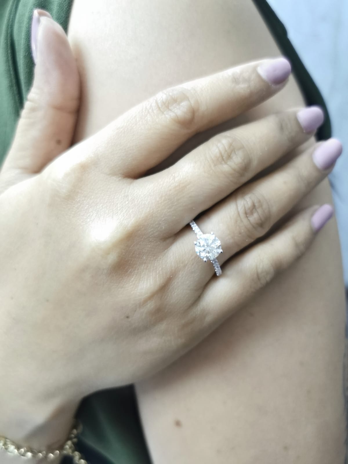 18K white gold engagement ring with 1.86 carat round diamond and 0.31 carats of accent diamonds on the band