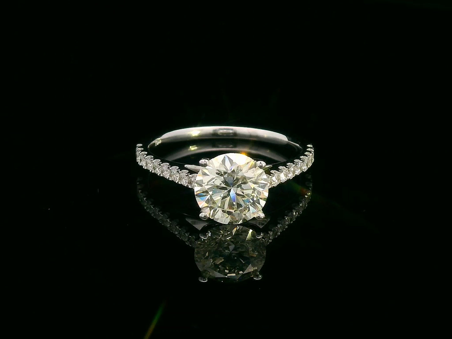 18K white gold engagement ring with 1.86 carat round diamond and 0.31 carats of accent diamonds on the band