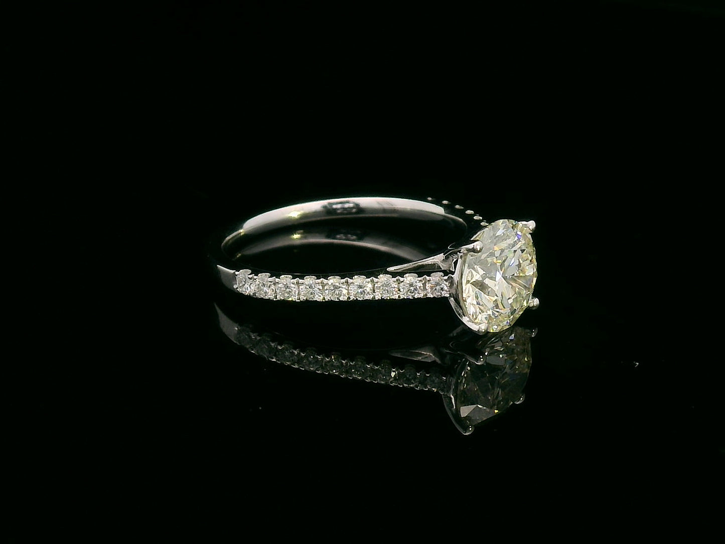 18K white gold engagement ring with 1.86 carat round diamond and 0.31 carats of accent diamonds on the band