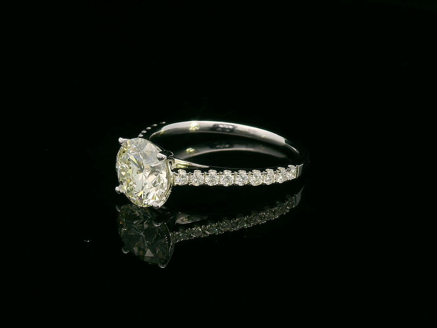 18K white gold engagement ring with 1.86 carat round diamond and 0.31 carats of accent diamonds on the band