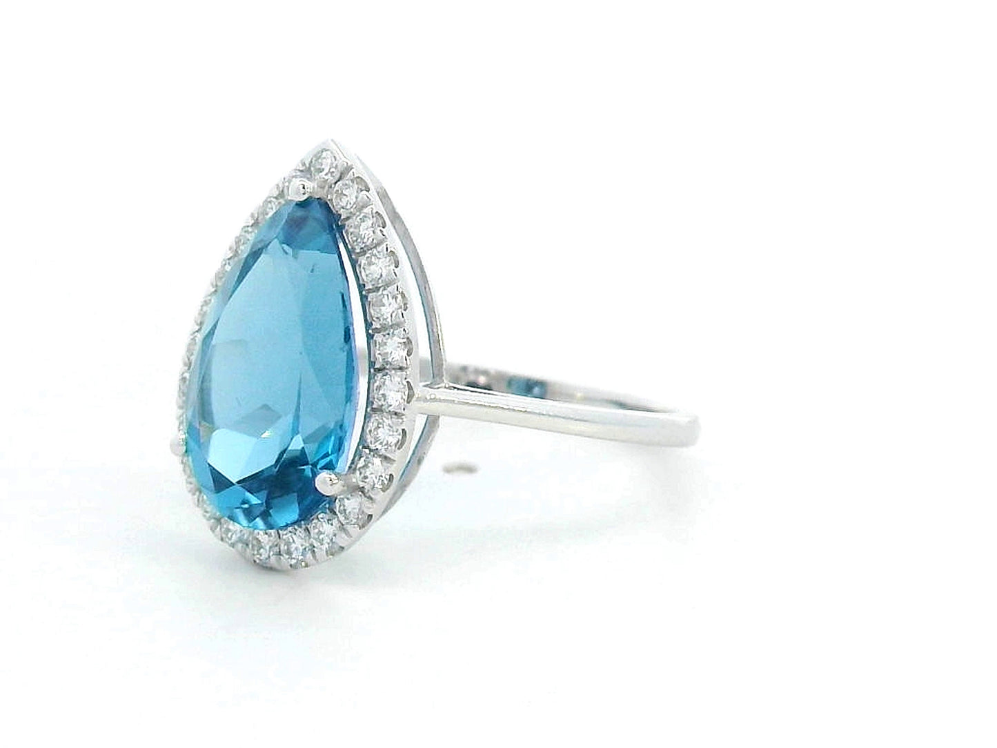 18K white gold ring with 5.26 carat pear-cut London Blue Topaz and diamond halo