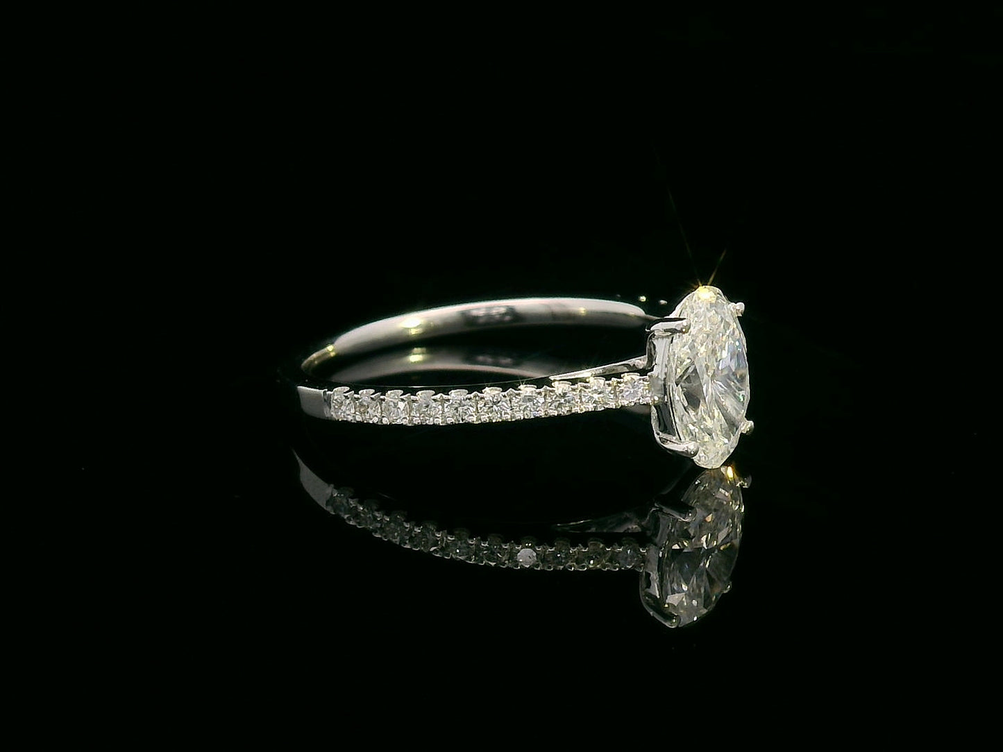 18K white gold oval diamond engagement ring with round diamonds along band – 1.01 carat D color center stone, IGI certified