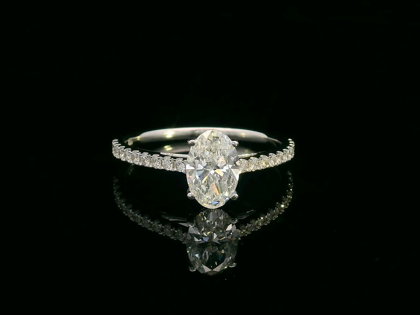 18K white gold oval diamond engagement ring with round diamonds along band – 1.01 carat D color center stone, IGI certified